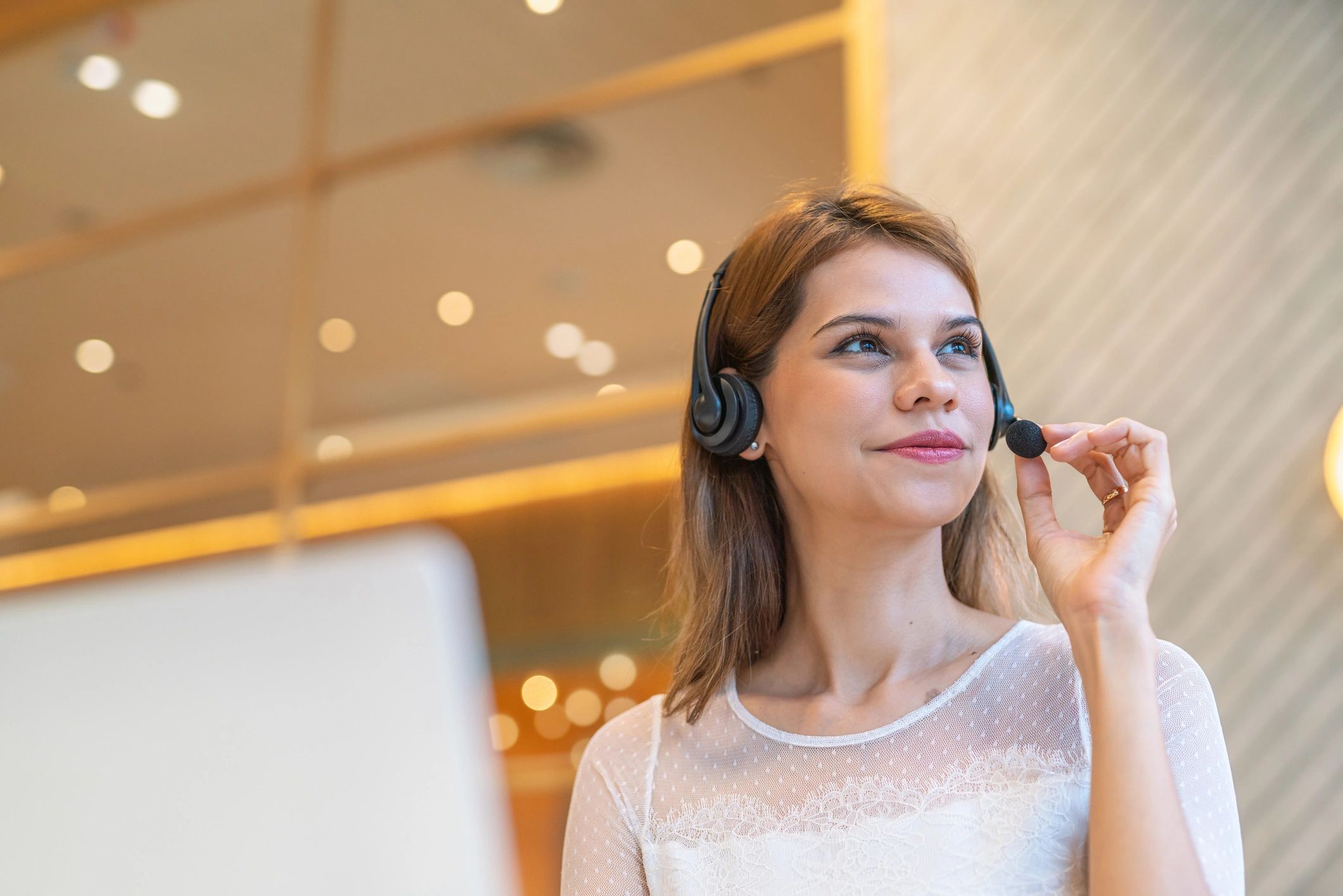 Customer support representative working at a shared workspace